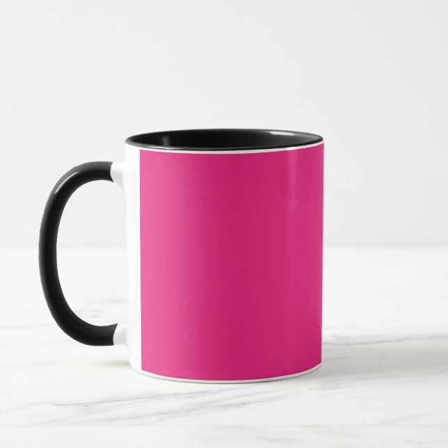 a pink background with a black border mug (Left)