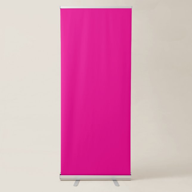 a pink background with a black border retractable banner (Front)