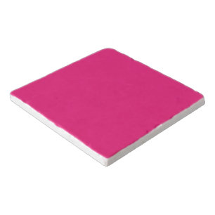 a pink background with a black border trivet