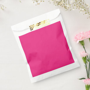 a pink background with a black favor bag
