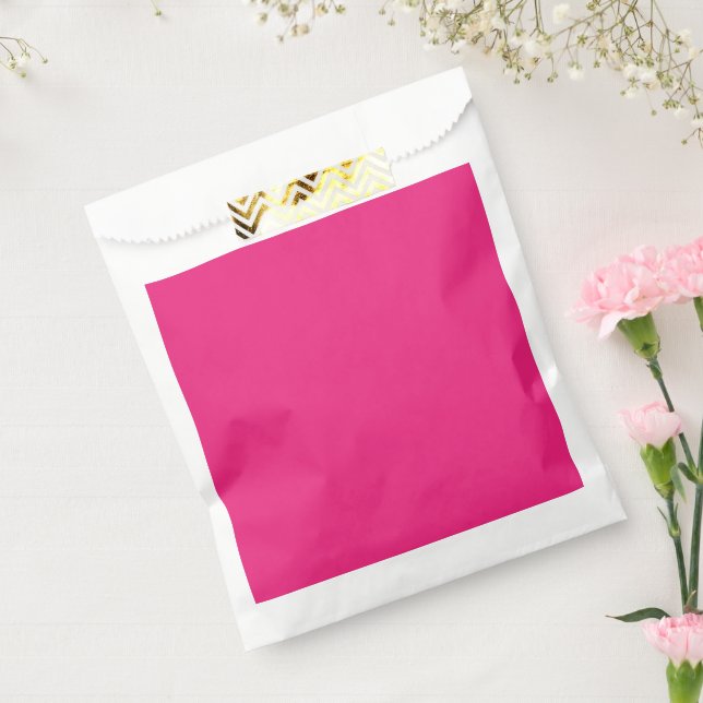 a pink background with a black favor bag (Sealed)