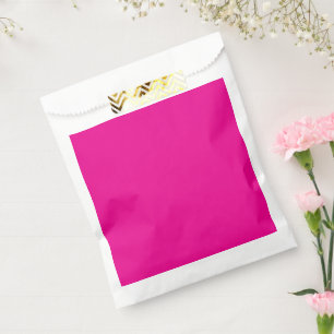 a pink background with a  favor bag