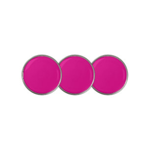 a pink background with a  golf ball marker