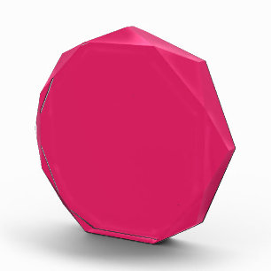 a pink background with a white border acrylic award