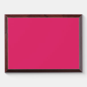 a pink background with a white border award plaque