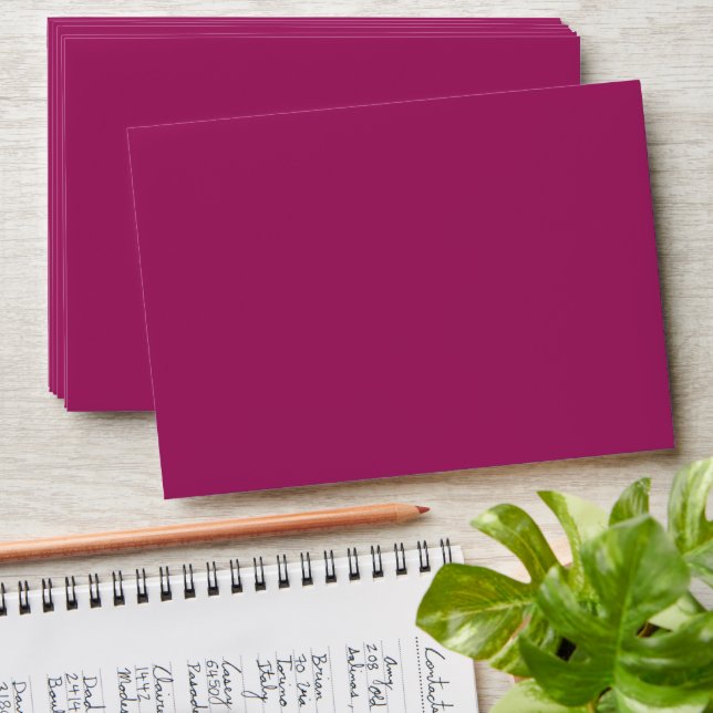 a pink background with a white border envelope (Stacked)