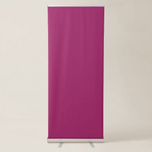 a pink background with a white border retractable banner