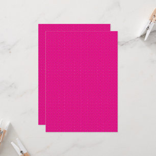a pink background with white polka dots invitation