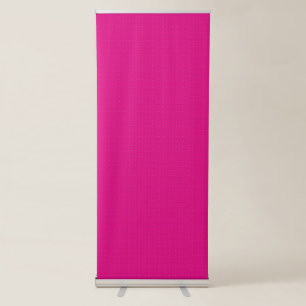 a pink background with white polka dots retractable banner
