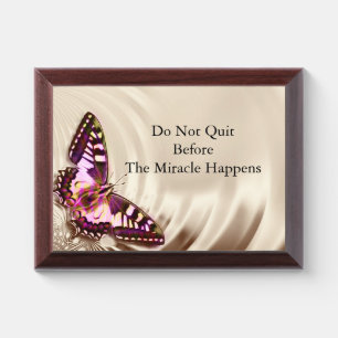A pink butterfly on a cream satin background award plaque