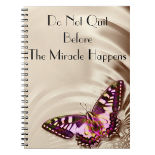 A pink butterfly on a cream satin background notebook