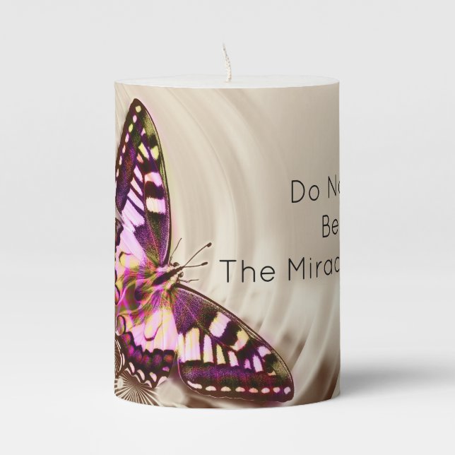 A pink butterfly on a cream satin background pillar candle (Front)