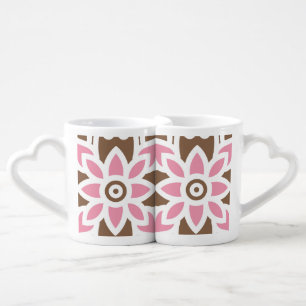 a pink flower on a brown background coffee mug set