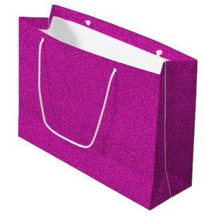 A pink glitter shopping bag with white handles