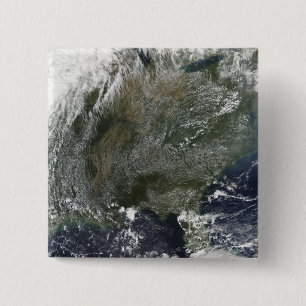 A pinwheel-like pattern of high pressure clouds pinback button
