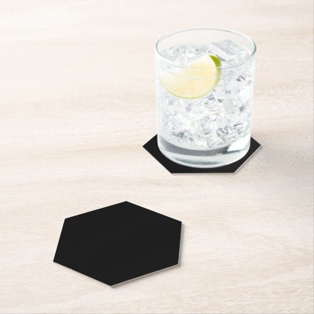 A plain dark black textured background fills paper coaster (Insitu)