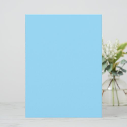 A plain light blue background fills the image card