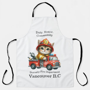 A playful kitten firefighter on a bright red truck apron