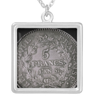 A pound of twenty sols silver plated necklace
