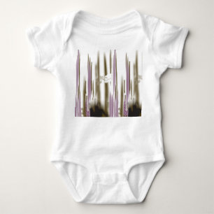 A pristine lake nestled among snow-capped mountain baby bodysuit