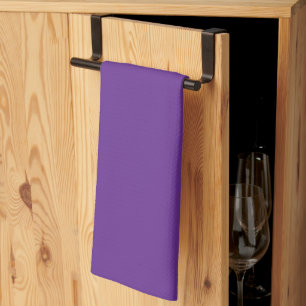 a purple background with a kitchen towel