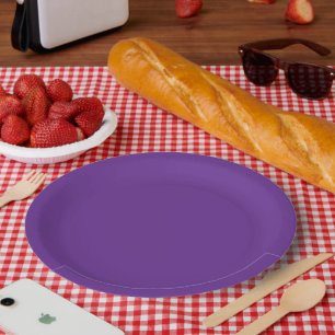 a purple background with a white border paper plates