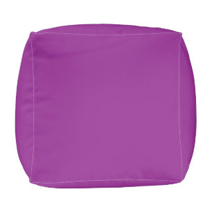 a purple background with a white border pouf