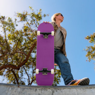 a purple background with a white border skateboard