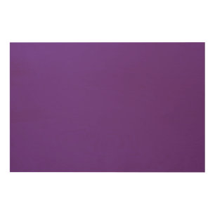 a purple background with a wood wall art
