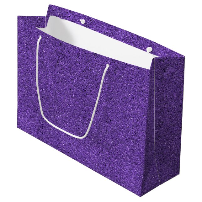 A purple glitter gift bag with a white handle (Front Angled)