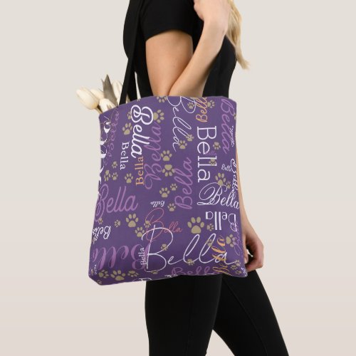 a purple personalized dog tote bag with paws