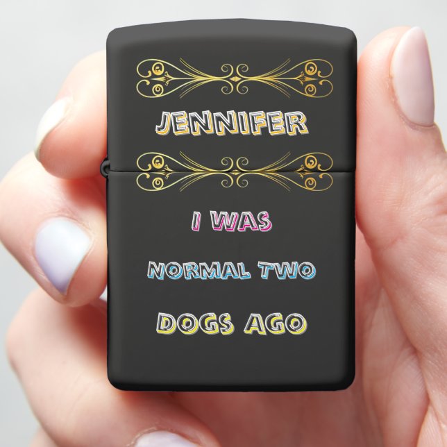 A quirky lighter with a humorous dog quote in hand (In Hand)