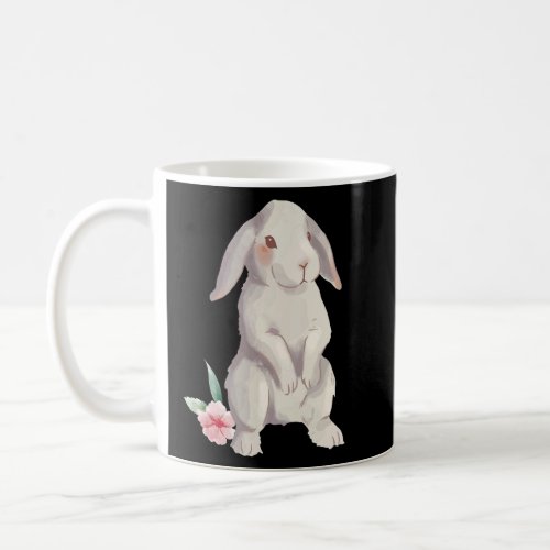 A rabbit with floppy ears in watercolour with a fl coffee mug