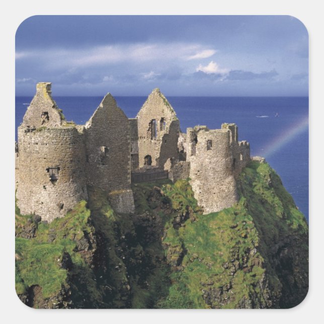 A rainbow strikes medieval Dunluce Castle on Square Sticker (Front)