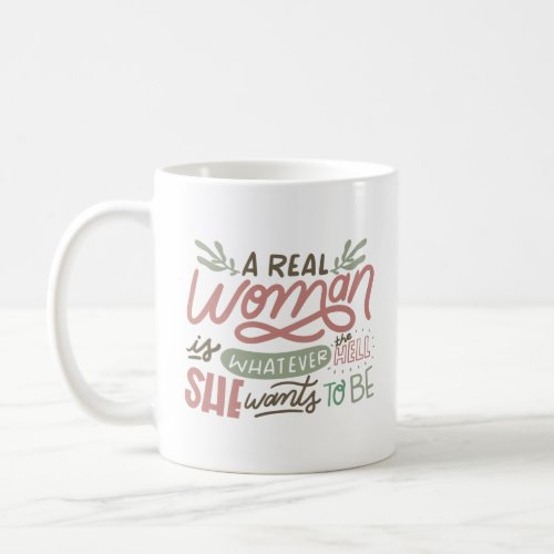 A REAL WOMEN IS WHATEVER THE HELL SHE WANTS TO BE COFFEE MUG