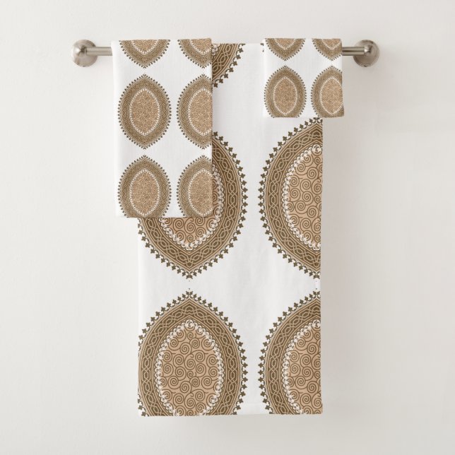 A rectangular rug with an intricate geometric moti bath towel set (Insitu)