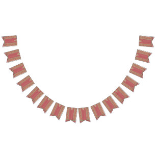 a red and beige rug with a gold border bunting flags