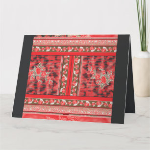 a red and green floral design on a black backgroun thank you card