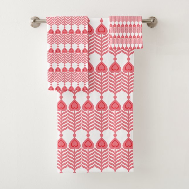 A red and pink geometric pattern featuring interlo bath towel set (Insitu)