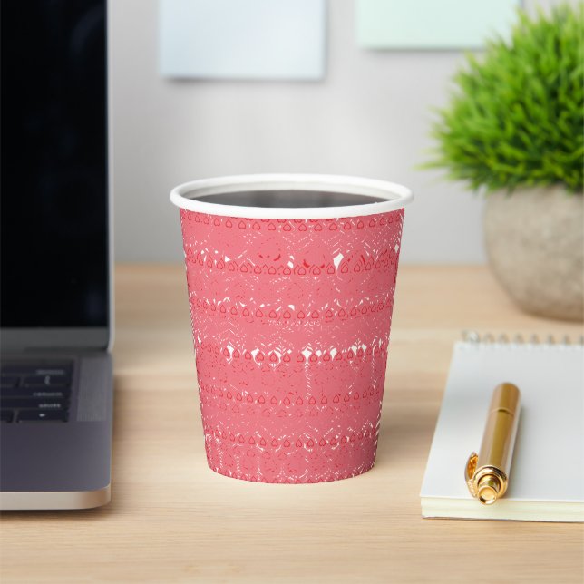 A red and pink geometric pattern featuring interlo paper cups (Insitu)