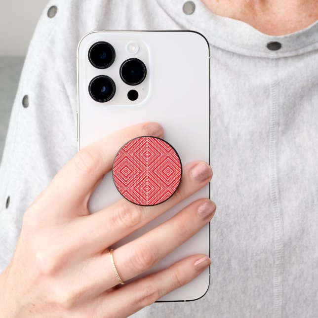 a red and white background with a diamond pattern PopSocket (Hand)