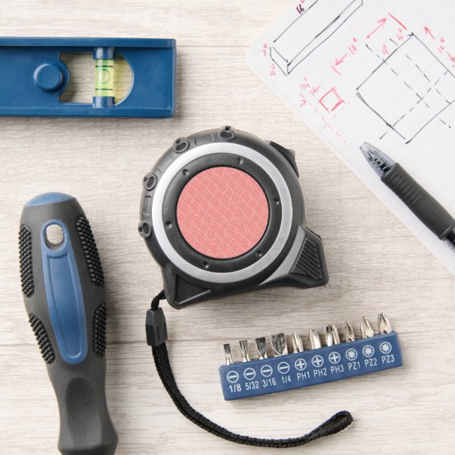 a red and white background with a pattern tape measure (Workshop)