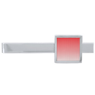 a red and white background with small squares silver finish tie bar