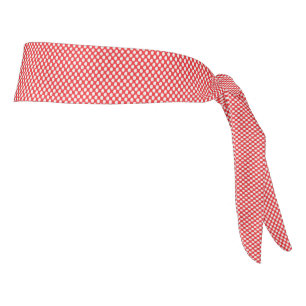 a red and white background with small squares tie headband