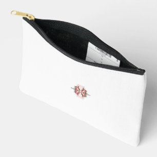 a red and white floral design on a white backgroun accessory pouch