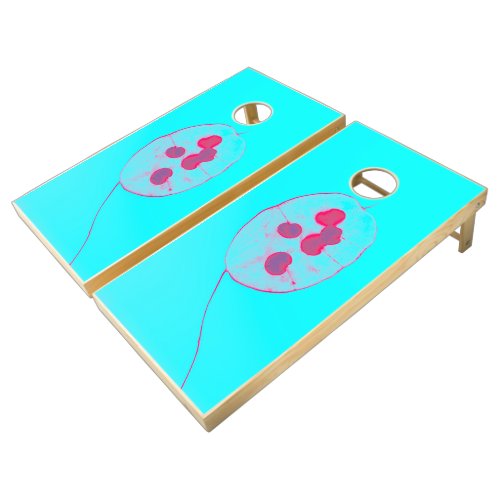 A red and white kite flying in a blue sky cornhole set