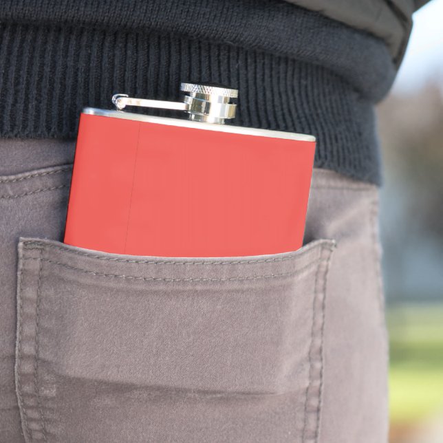 a red background with a white border flask (In Situ)