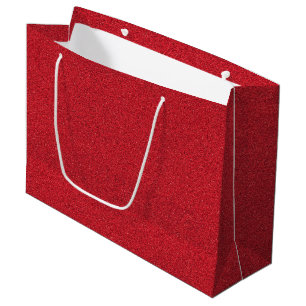 A red glitter gift bag with white handles