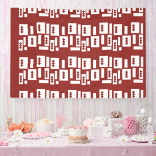A red rug with a textured pattern is spread out on banner