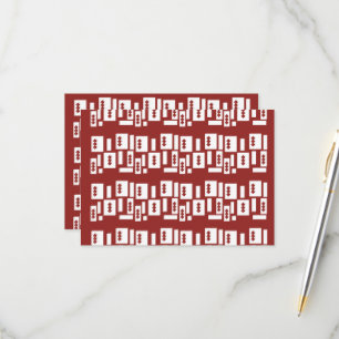 A red rug with a textured pattern is spread out on RSVP card